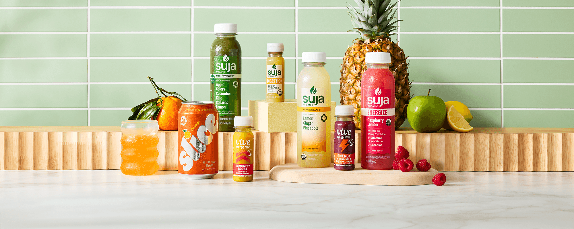 Suja Life product lineup featuring Suja Organic, Vive Organic and Slice beverages